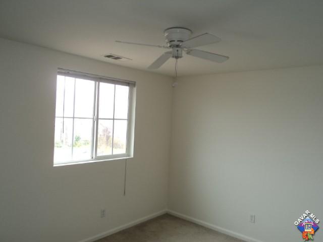 5753 Monaco Drive Palmdale, CA 93552 - Photo 16 of 29 an empty room with a window