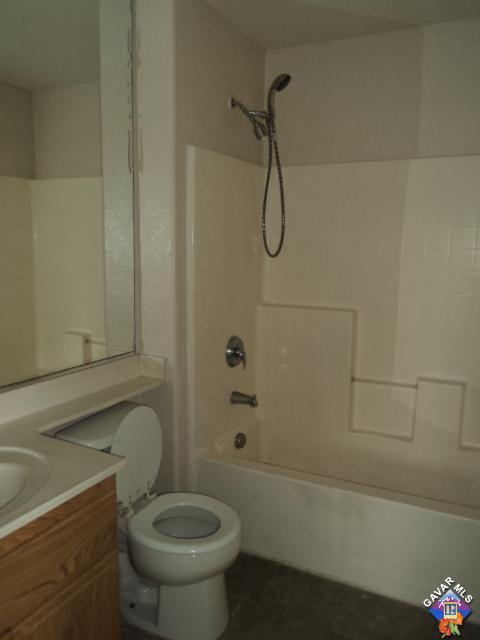 5753 Monaco Drive Palmdale, CA 93552 - Photo 17 of 29 a bathroom with a toilet and a shower