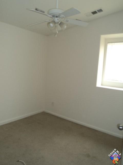 5753 Monaco Drive Palmdale, CA 93552 - Photo 18 of 29 an empty room with a window