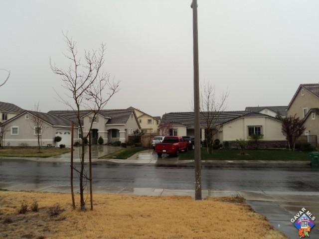 5753 Monaco Drive Palmdale, CA 93552 - Photo 22 of 29 a front view of a house with a yard
