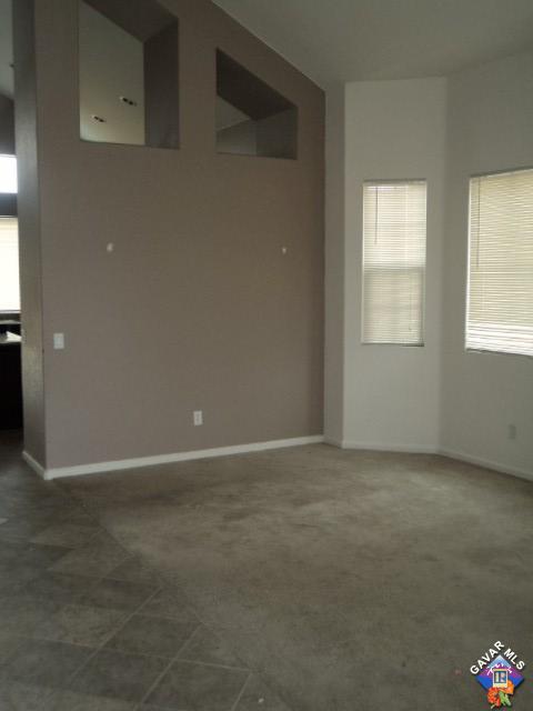5753 Monaco Drive Palmdale, CA 93552 - Photo 3 of 29 an empty room with windows