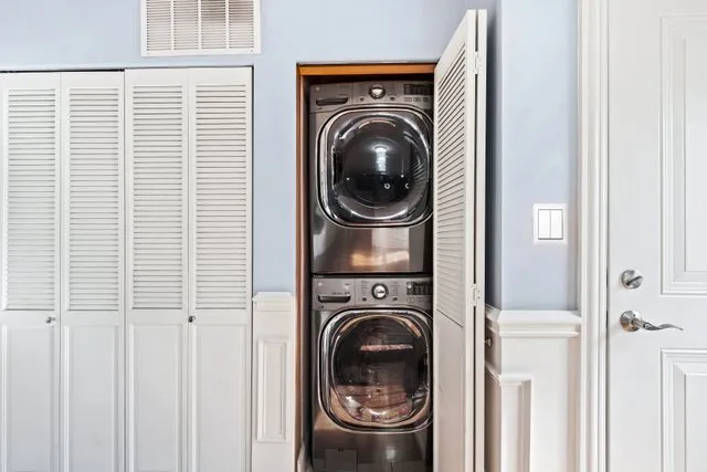a view of a hallway with washer and dryer