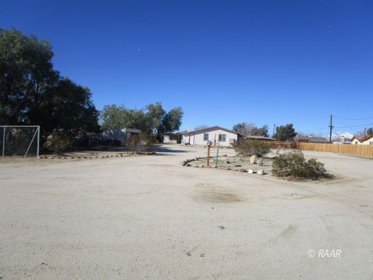 518 West Upjohn Avenue Ridgecrest, CA 93555 - Photo 6 of 24 a view of road with big yard
