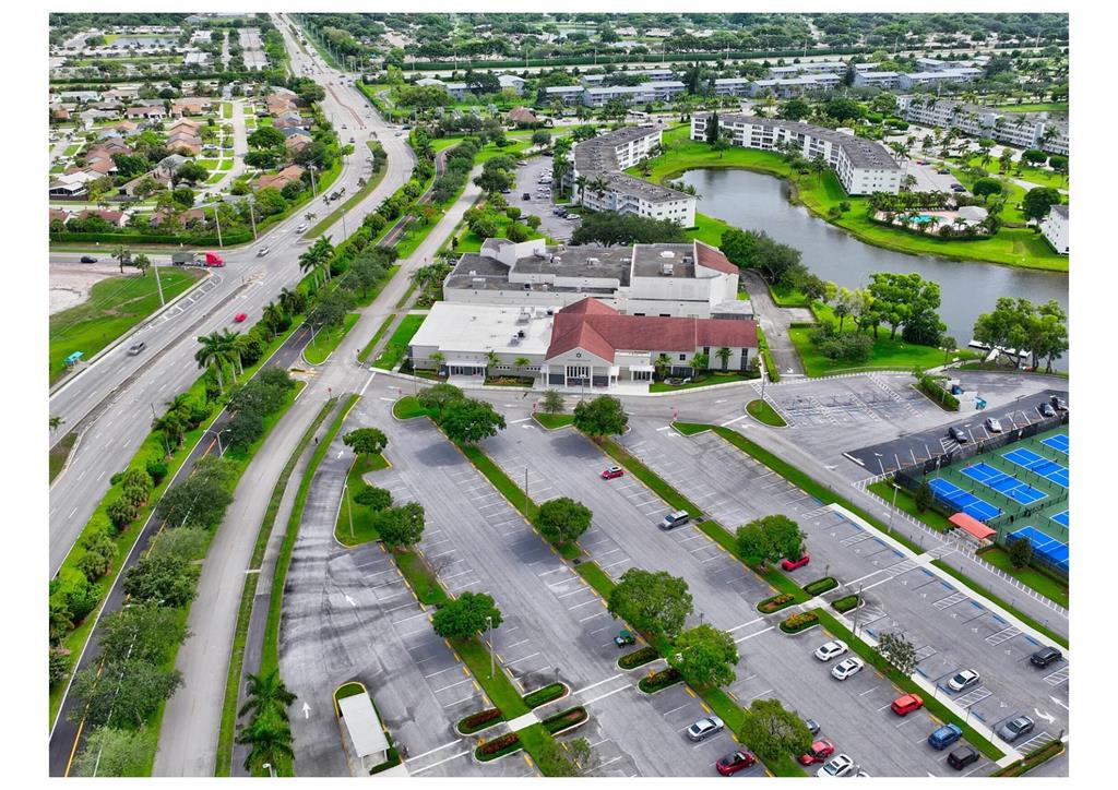 251 Preston F, Unit 251 Boca Raton, FL 33434 - Photo 30 of 35 an aerial view of a city with lots of residential buildings