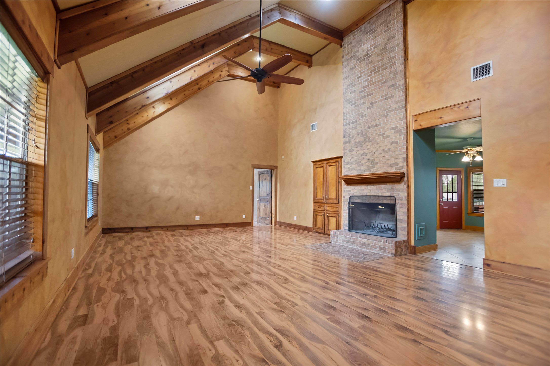 22916 East Martin Drive Porter, TX 77365 - Photo 6 of 43 a view of an empty room with wooden floor and a window