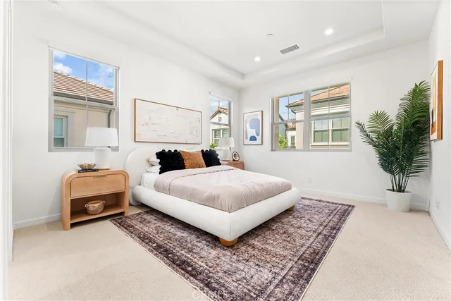 a bedroom with a bed and a couch