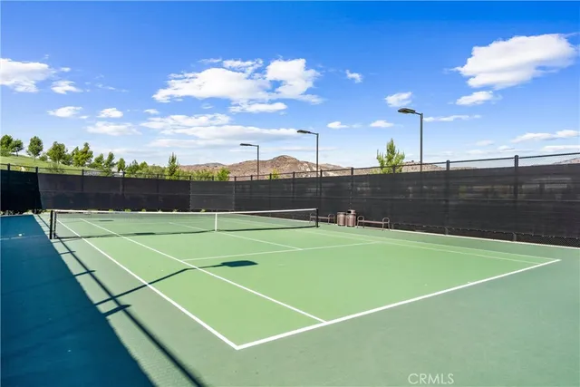 a view of an outdoor space and tennis court