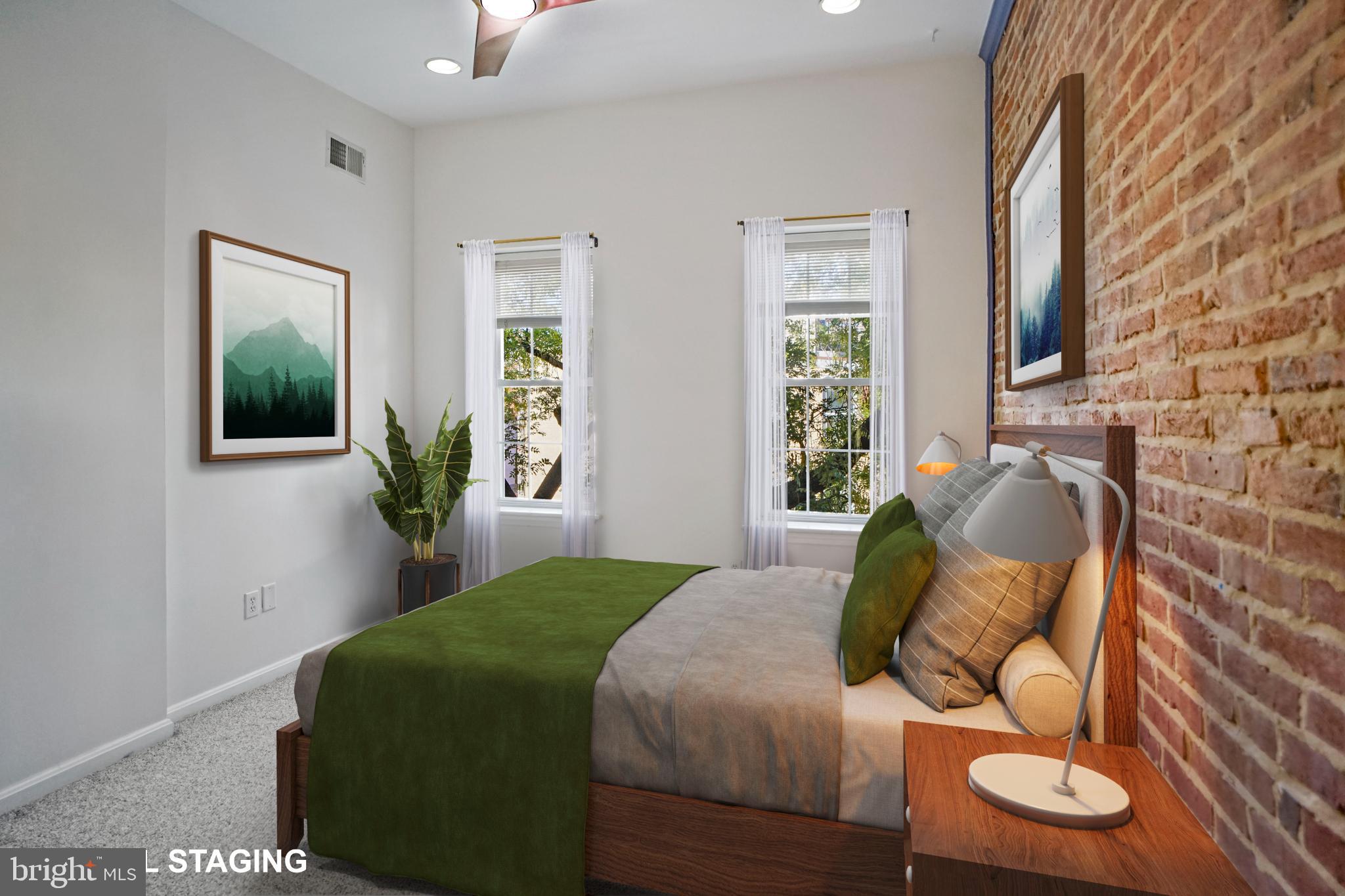 1417 Covington Street Baltimore, MD 21230 - Photo 12 of 25 a bedroom with a bed and mirror