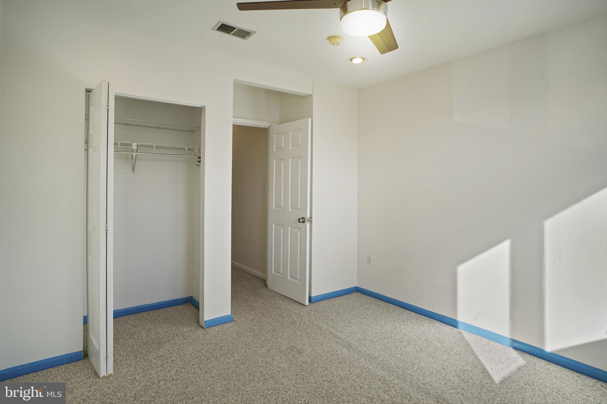 1417 Covington Street Baltimore, MD 21230 - Photo 17 of 25 a view of an empty room with a ceiling fan