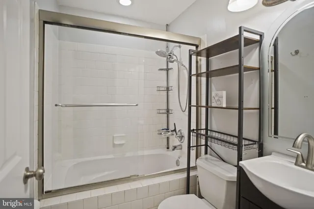 a bathroom with a shower and a toilet