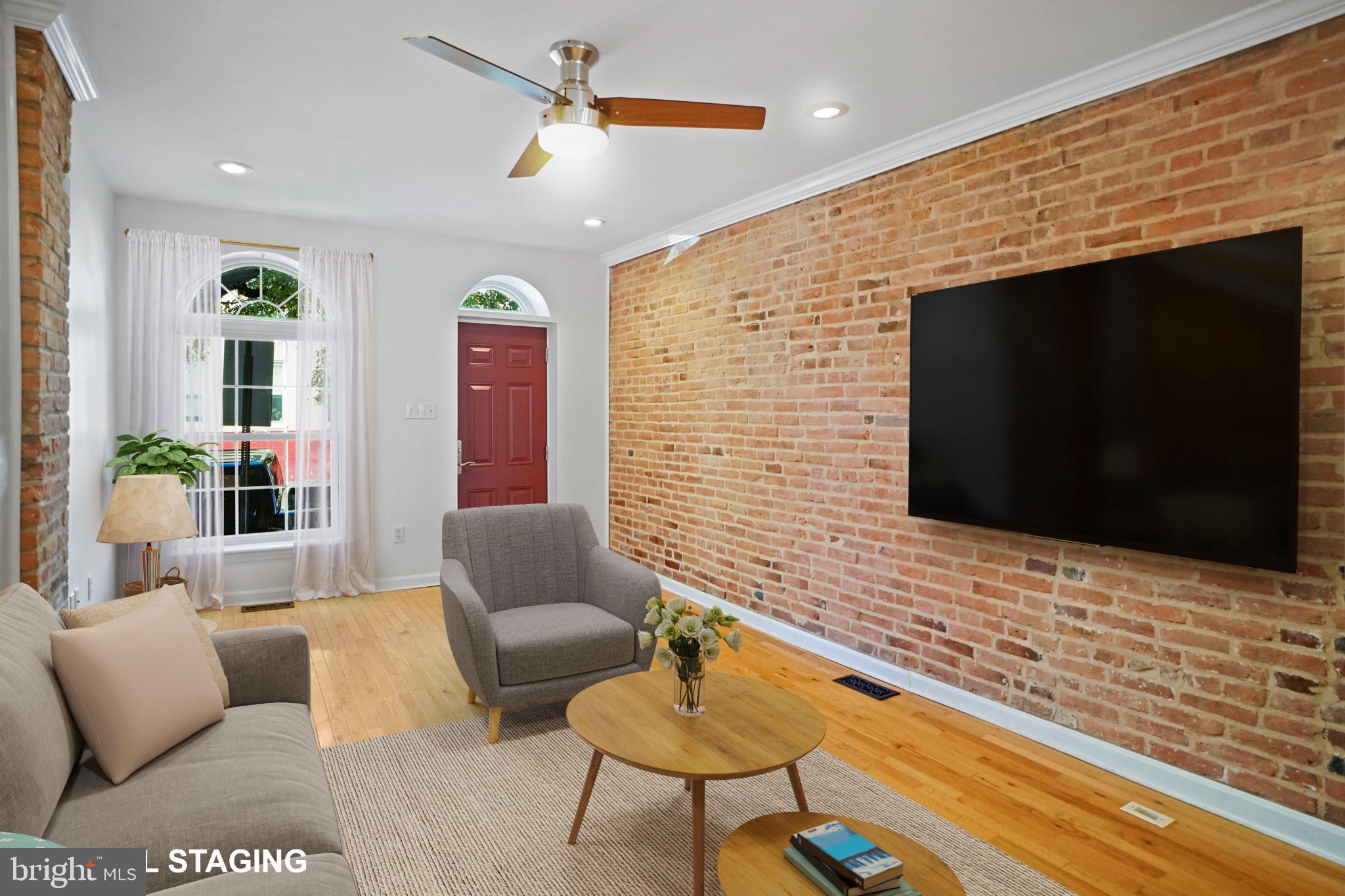 1417 Covington Street Baltimore, MD 21230 - Photo 5 of 25 a living room with furniture and a flat screen tv