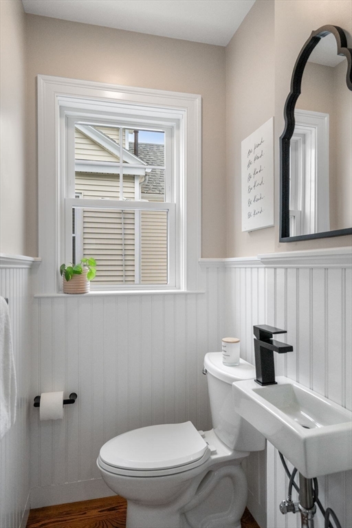 79 Read Street Winthrop, MA 02152 - Photo 16 of 33 a bathroom with a toilet a sink a mirror and a window
