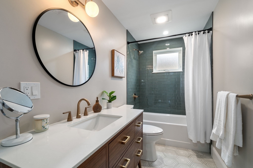 79 Read Street Winthrop, MA 02152 - Photo 24 of 33 a bathroom with a double vanity sink mirror double shower and a mirror