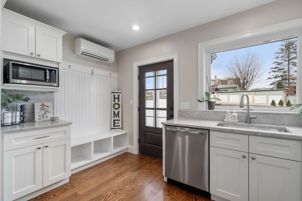 79 Read Street Winthrop, MA 02152 - Photo 9 of 33 a kitchen with a sink stove and cabinets