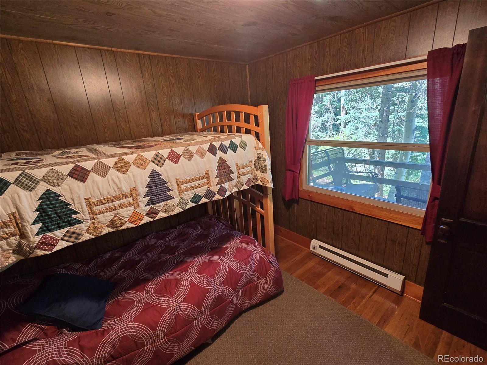 9626 Highway 165 Rye, CO 81069 - Photo 17 of 27 a bed sitting in a bedroom next to a window