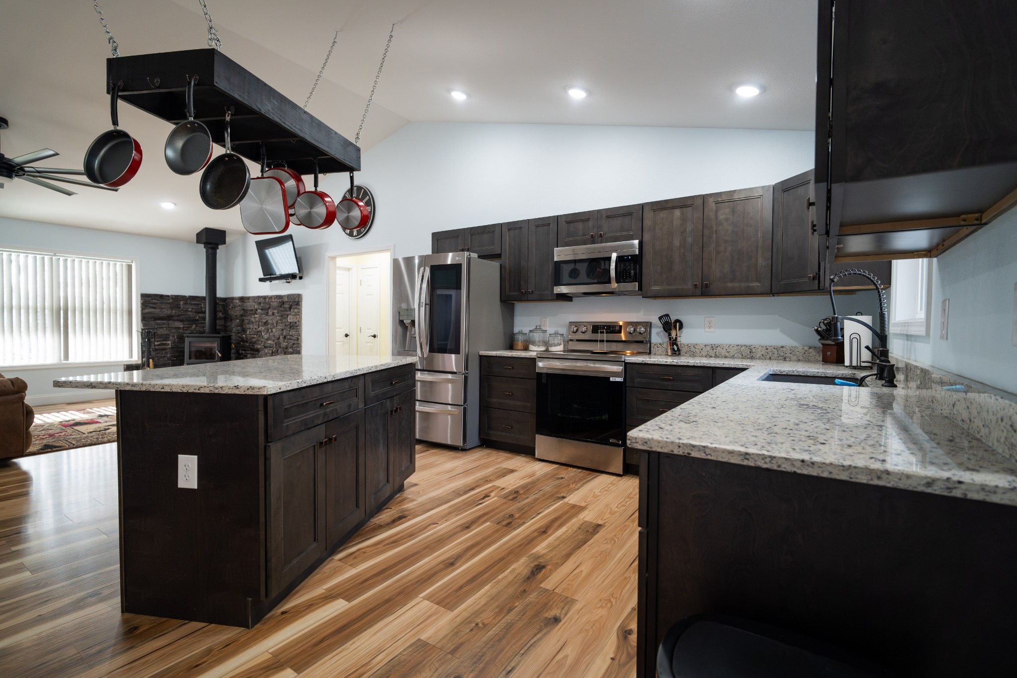 1561 Bicknell Road Clarkrange, TN 38553 - Photo 16 of 44 a kitchen with stainless steel appliances granite countertop a sink a stove and a refrigerator
