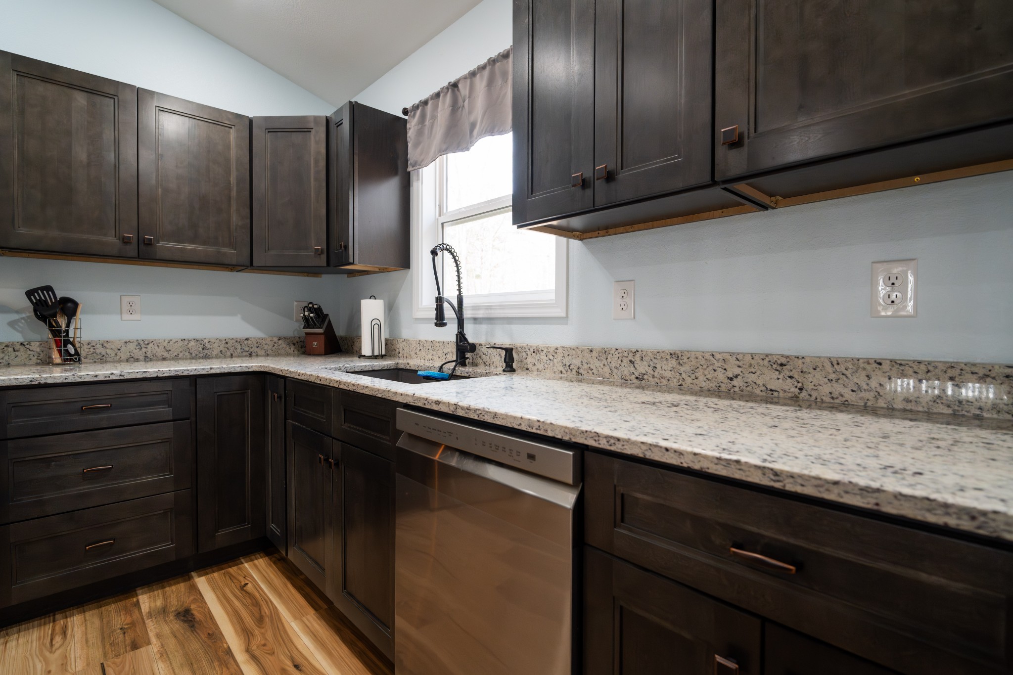 1561 Bicknell Road Clarkrange, TN 38553 - Photo 17 of 44 a kitchen with granite countertop wooden cabinets and a sink