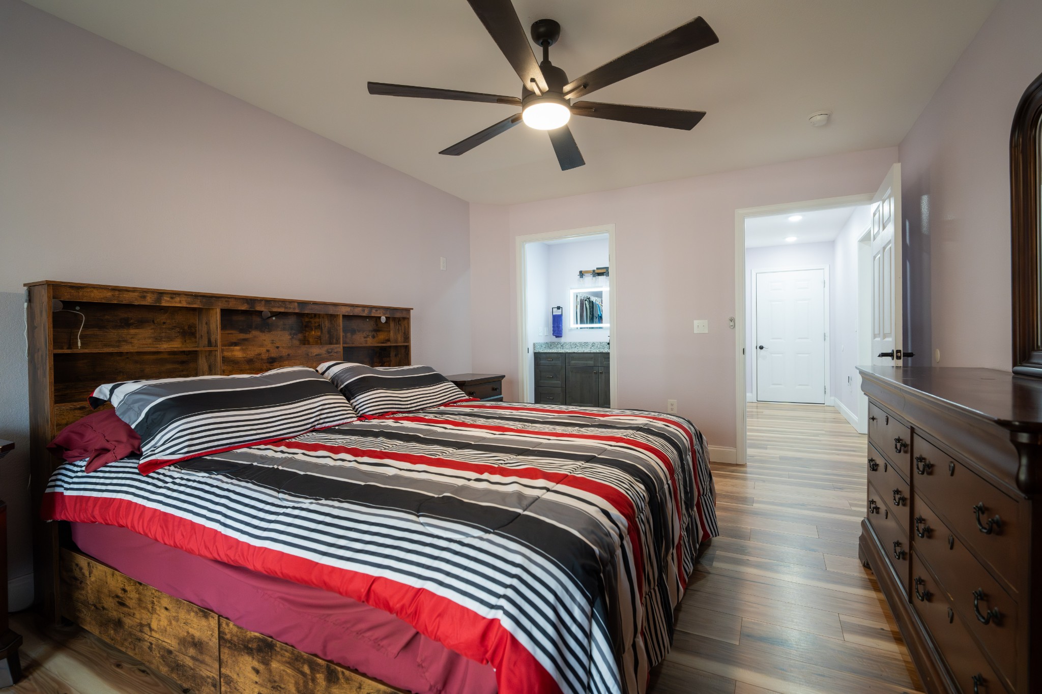 1561 Bicknell Road Clarkrange, TN 38553 - Photo 23 of 44 a bedroom with a bed and a chandelier