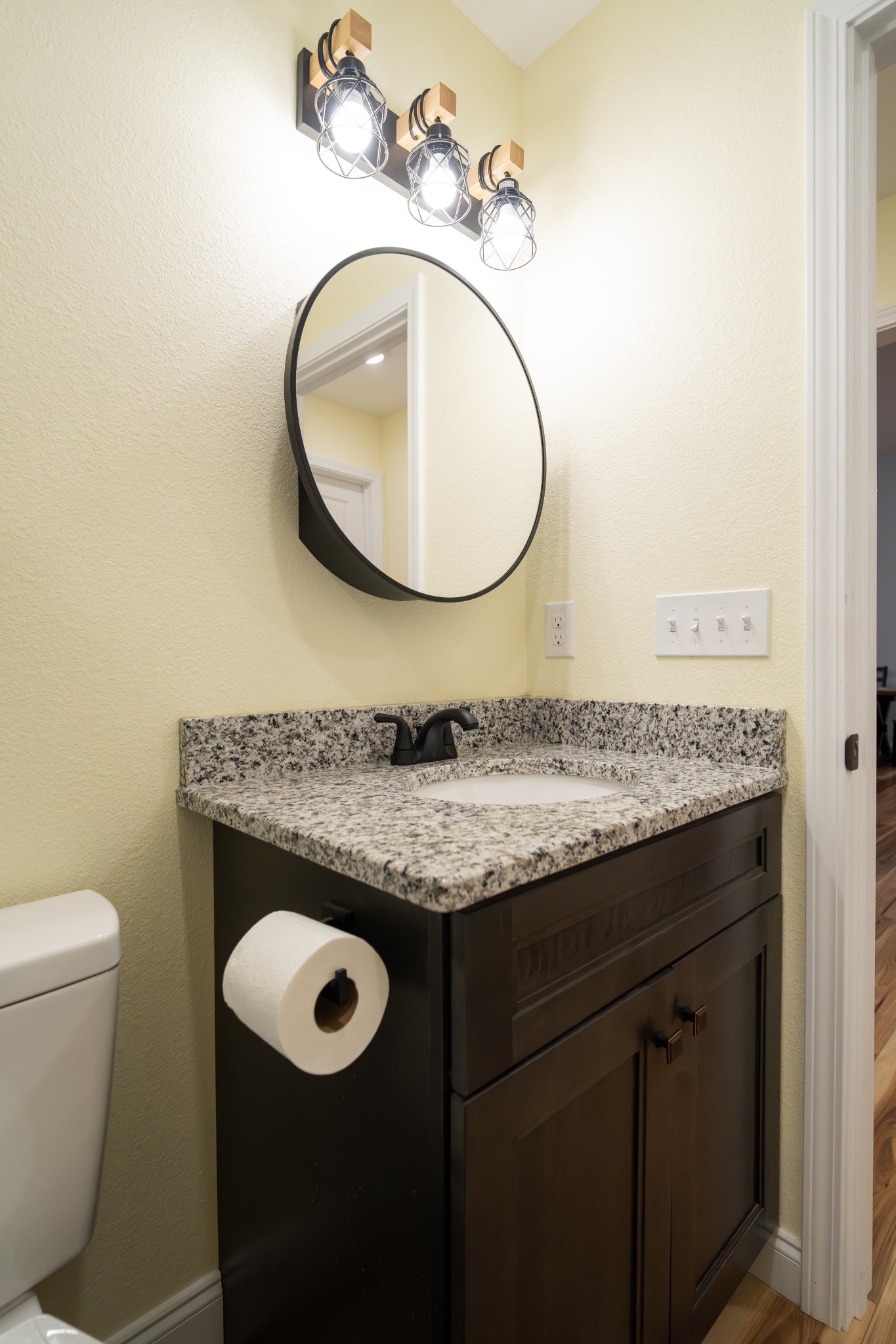 1561 Bicknell Road Clarkrange, TN 38553 - Photo 32 of 44 a bathroom with a granite countertop toilet sink and mirror