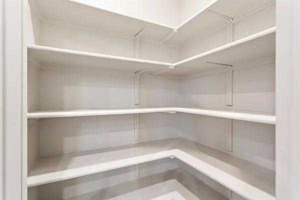 a view of storage and utility room with empty racks
