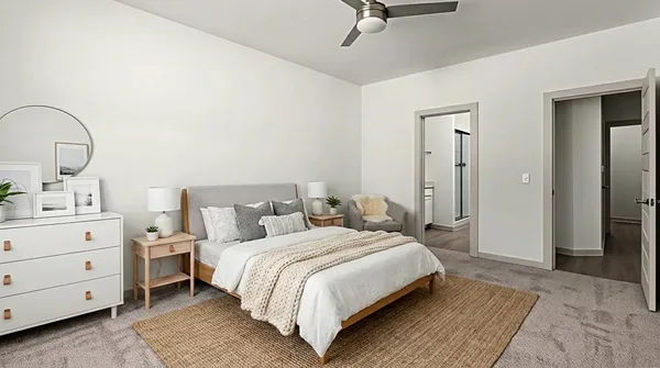 a bedroom with a bed and a dresser