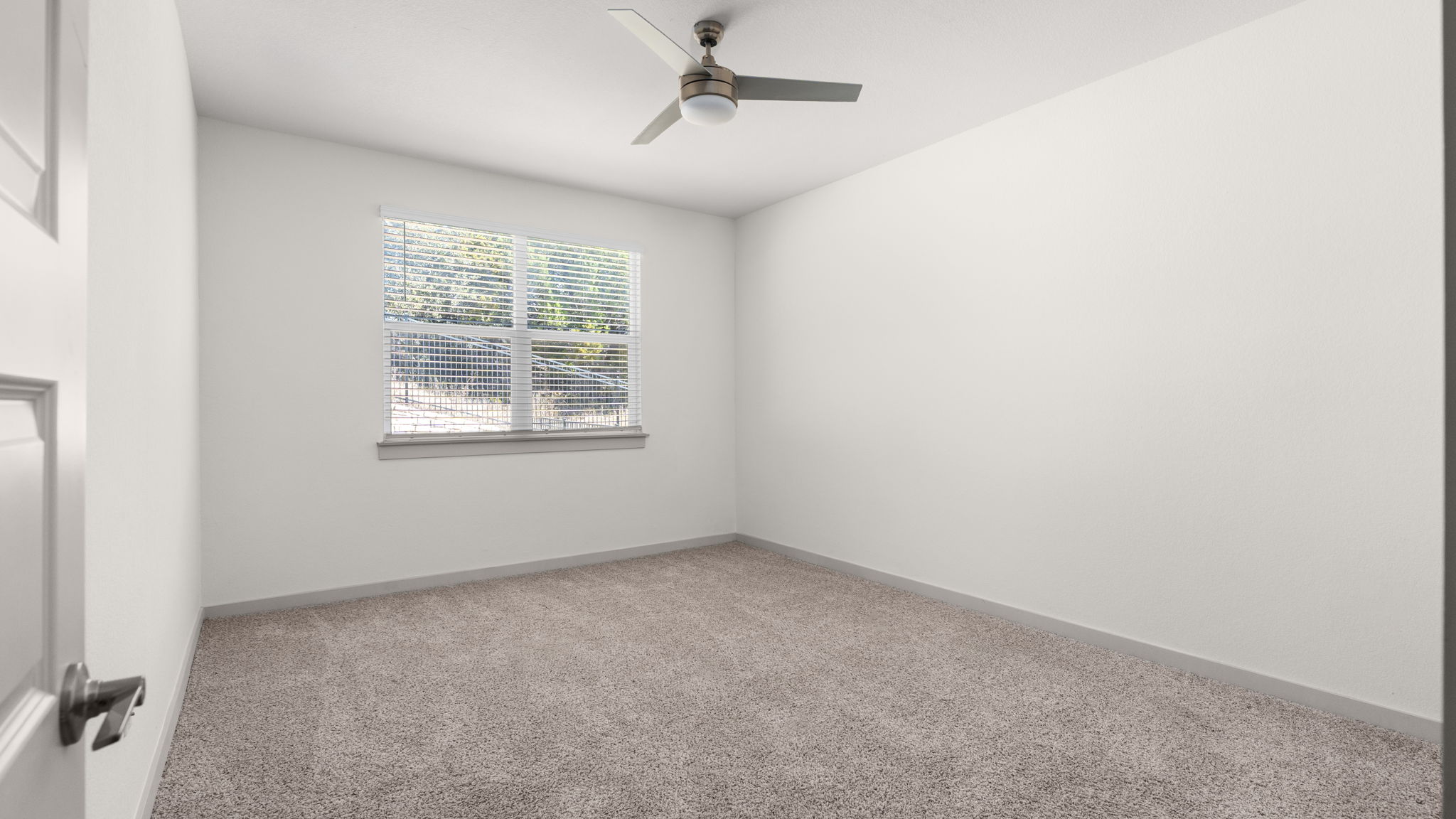 101 Merrick Road Georgetown, TX 78628 - Photo 20 of 38 First floor, primary bedroom with light colored carpet and ceiling fan