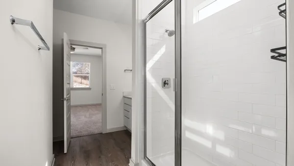 a view of a bathroom from a hallway