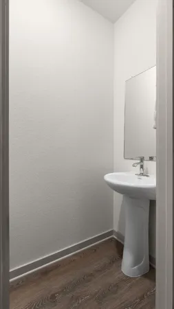 a bathroom with a sink and mirror