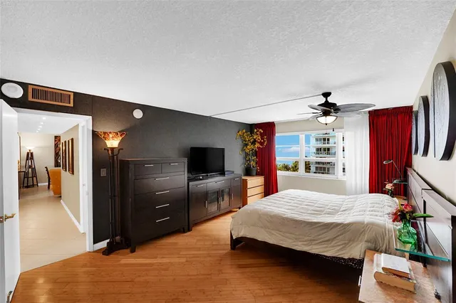 a bedroom with furniture and natural light