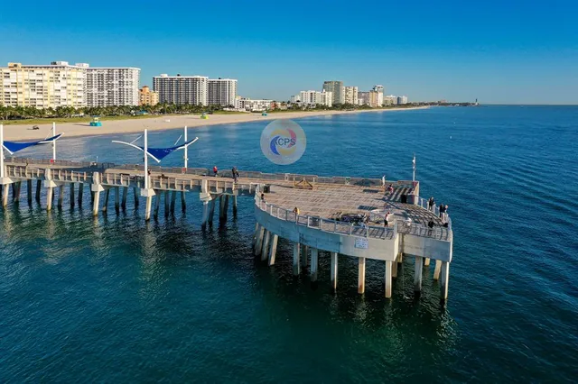 a view of a chairs and table on the deck