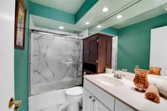 a bedroom with a bed and a balcony view