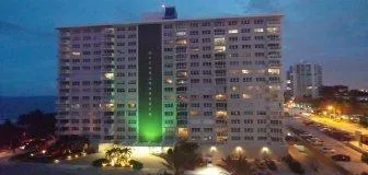 a view of a swimming pool and an outdoor seating