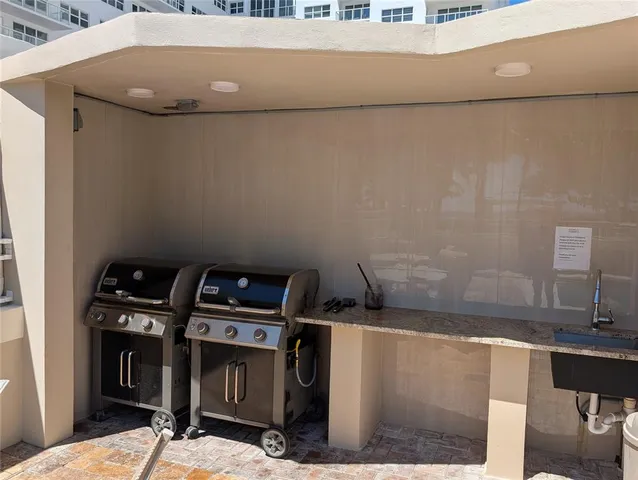 a terrace with outdoor seating and city view
