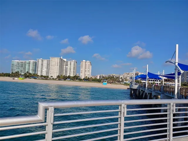 a view of a swimming pool with a yard