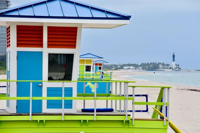 a dining room with furniture and a wooden floor