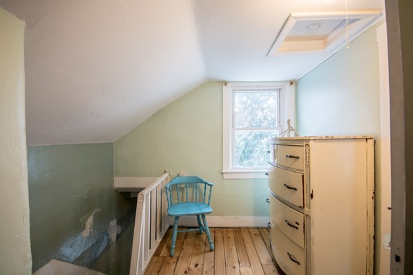 58 Detroit Street Fall River, MA 02721 - Photo 23 of 27 a bedroom with a bed and a window