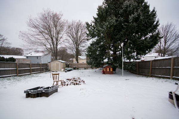 58 Detroit Street Fall River, MA 02721 - Photo 5 of 27 a view of a backyard space and wooden