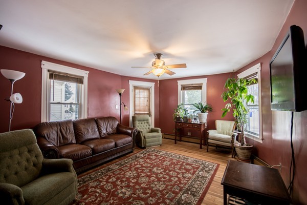 58 Detroit Street Fall River, MA 02721 - Photo 10 of 27 a living room with furniture flat screen tv and a large window