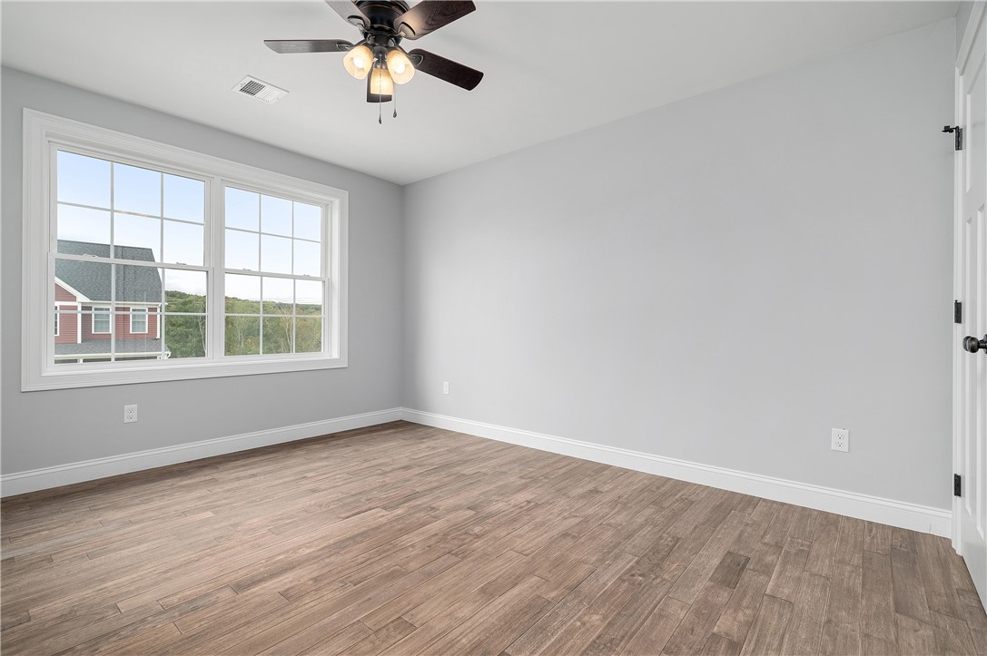 426 Louise Street Woonsocket, RI 02895 - Photo 22 of 33 2nd Bedroom, Ceiling Fan, Hardwood Floors
