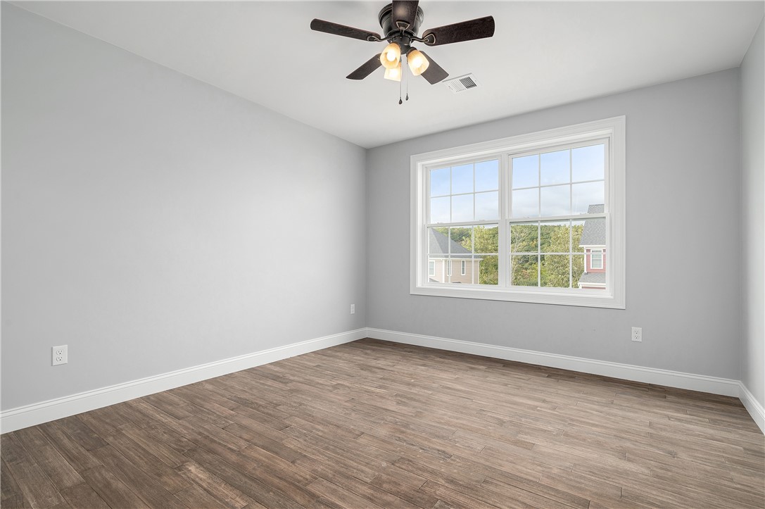 426 Louise Street Woonsocket, RI 02895 - Photo 23 of 33 3rd Bedroom, Ceiling Fan, Hardwood Floors