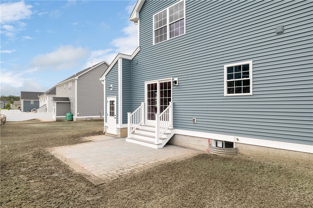 426 Louise Street Woonsocket, RI 02895 - Photo 30 of 33 Sliders from Dining Area to Pavers Patio and access to basement through Shed Bulkhead