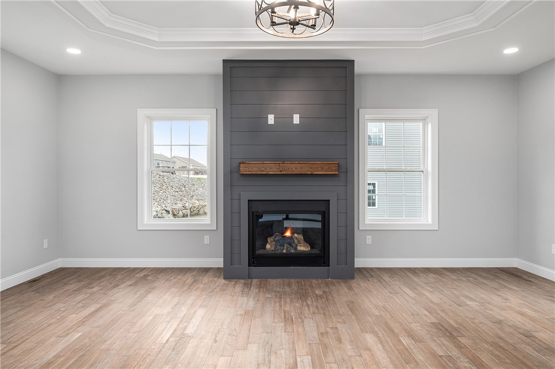 426 Louise Street Woonsocket, RI 02895 - Photo 4 of 33 Gorgeous Hardwood Floors throughout, Gas Fire Place w/Wood Surround and Mantel, Trayed Ceiling w/Chandelier and Recessed Lighting