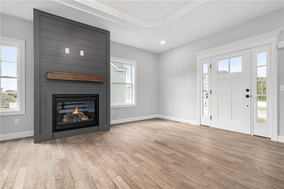 426 Louise Street Woonsocket, RI 02895 - Photo 5 of 33 Gorgeous Hardwood Floors throughout, Gas Fire Place w/Wood Surround and Mantel, Trayed Ceiling w/Chandelier and Recessed Lighting