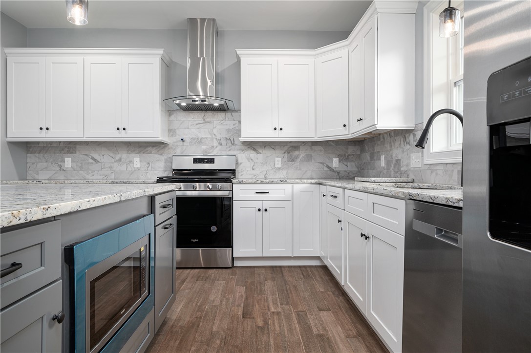 426 Louise Street Woonsocket, RI 02895 - Photo 10 of 33 Stainless Dishwasher, Refrigerator and Microwave tucked into Island