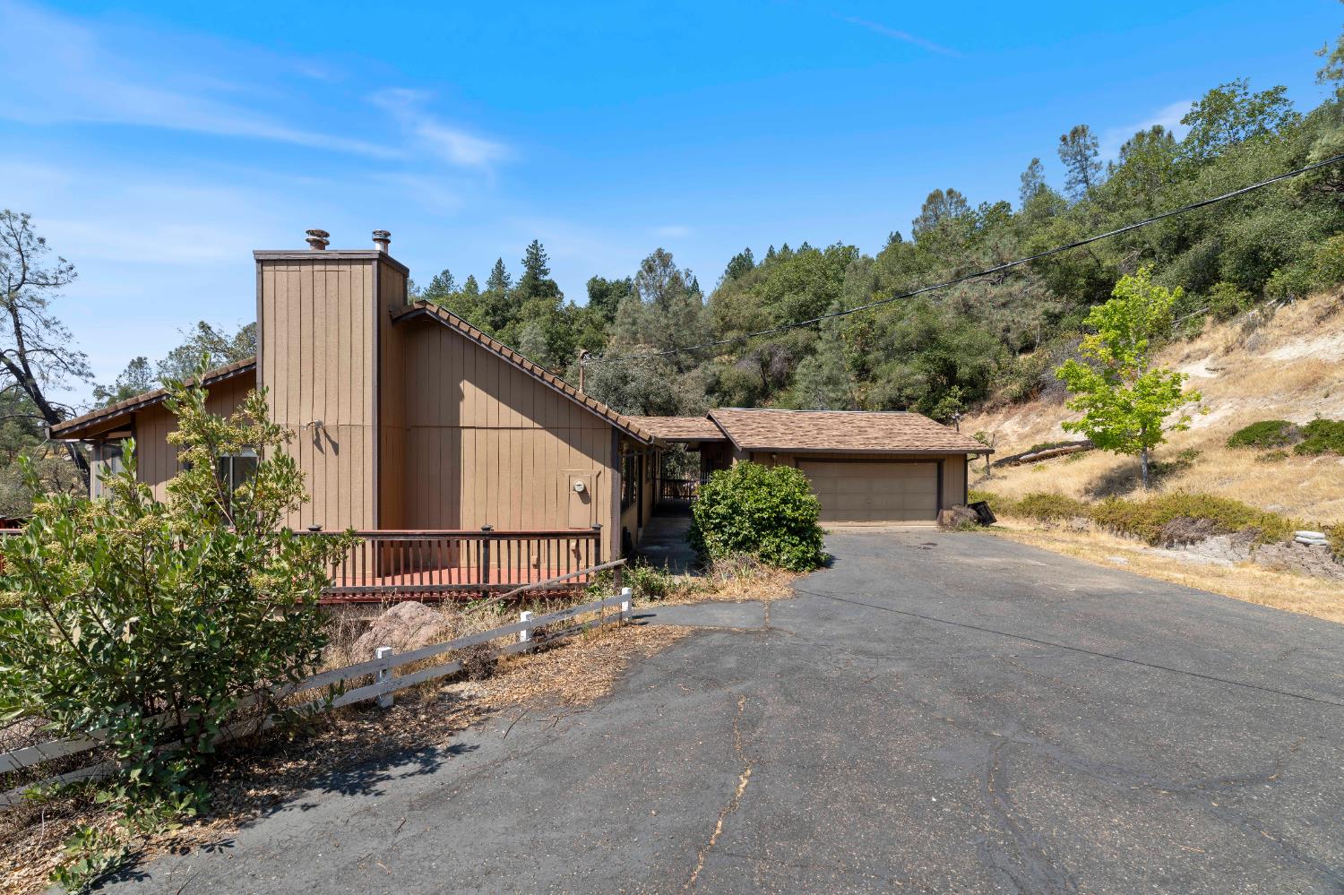 3830 Wilson Loop Placerville, CA 95667 - Photo 2 of 36 a view of a house with a backyard and trees