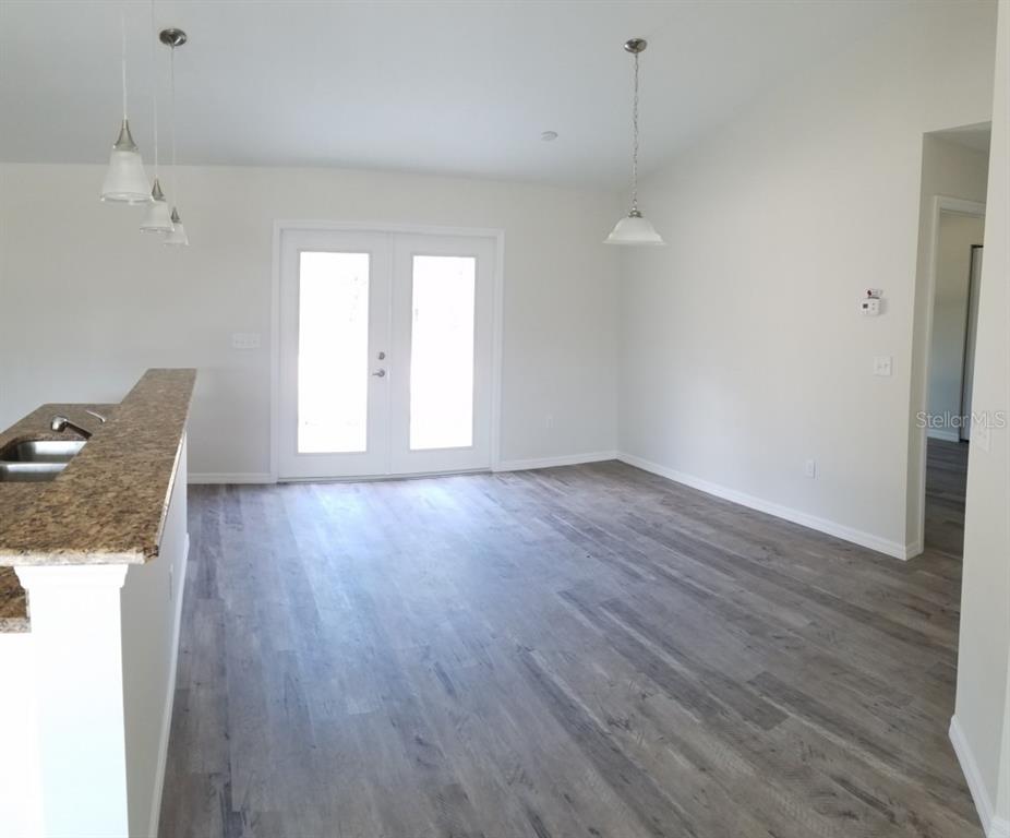 9 Fir Trail Ocala, FL 34472 - Photo 4 of 11 a view of a room with wooden floor and windows