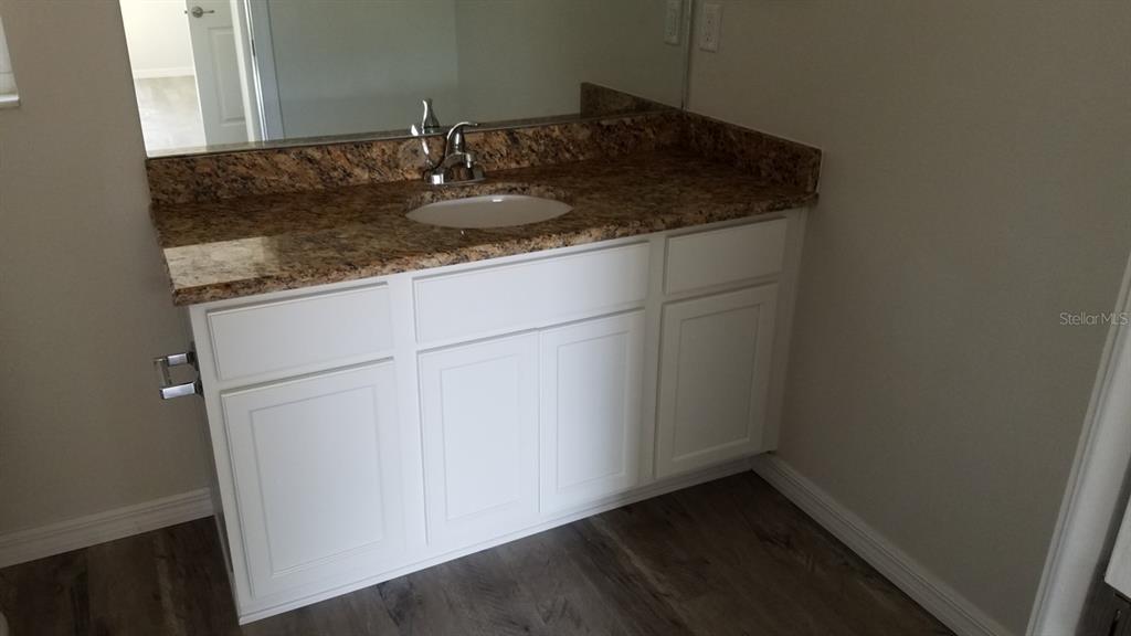 9 Fir Trail Ocala, FL 34472 - Photo 7 of 11 a kitchen with a sink and cabinets