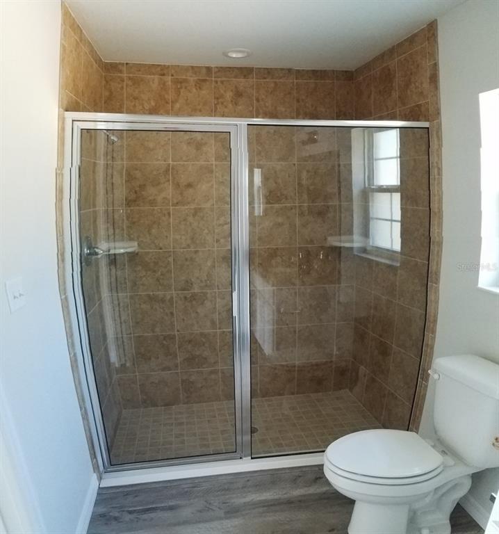 9 Fir Trail Ocala, FL 34472 - Photo 8 of 11 a bathroom with a shower and a toilet