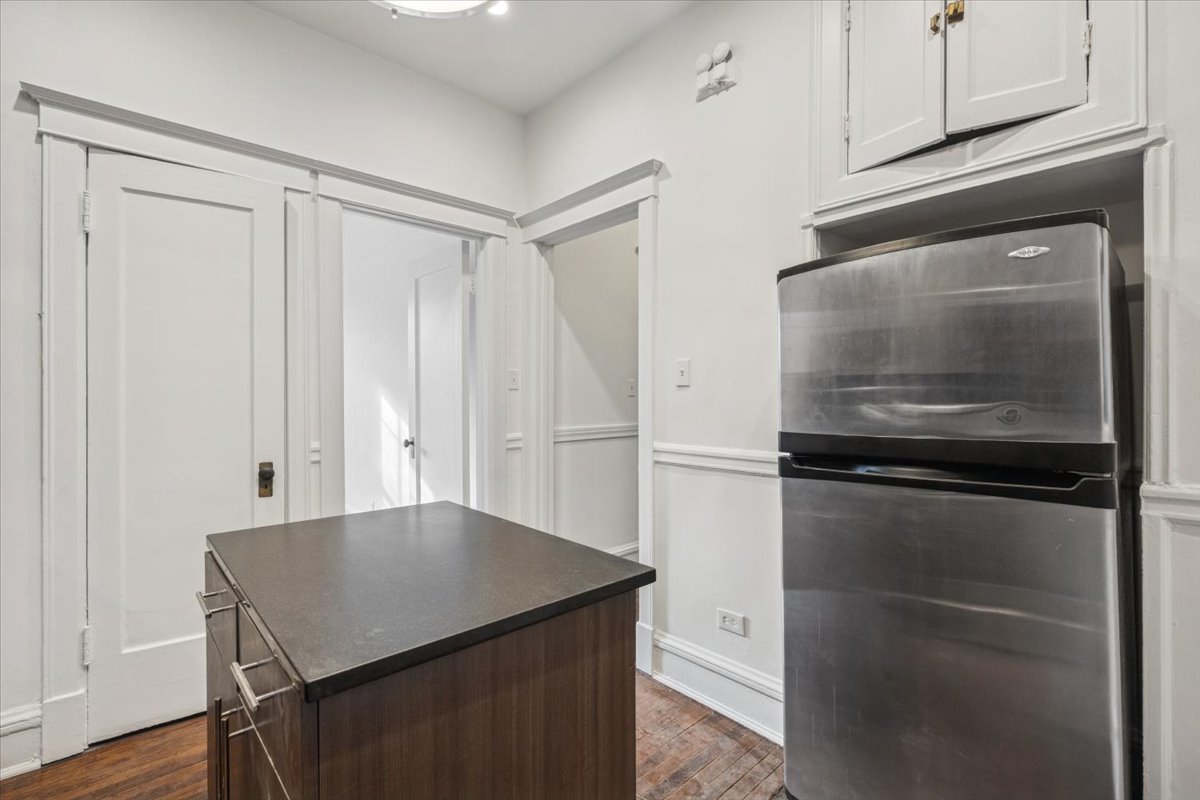 1201 Michigan Avenue, Unit 2 Evanston, IL 60202 - Photo 15 of 20 a kitchen with a refrigerator and cabinets