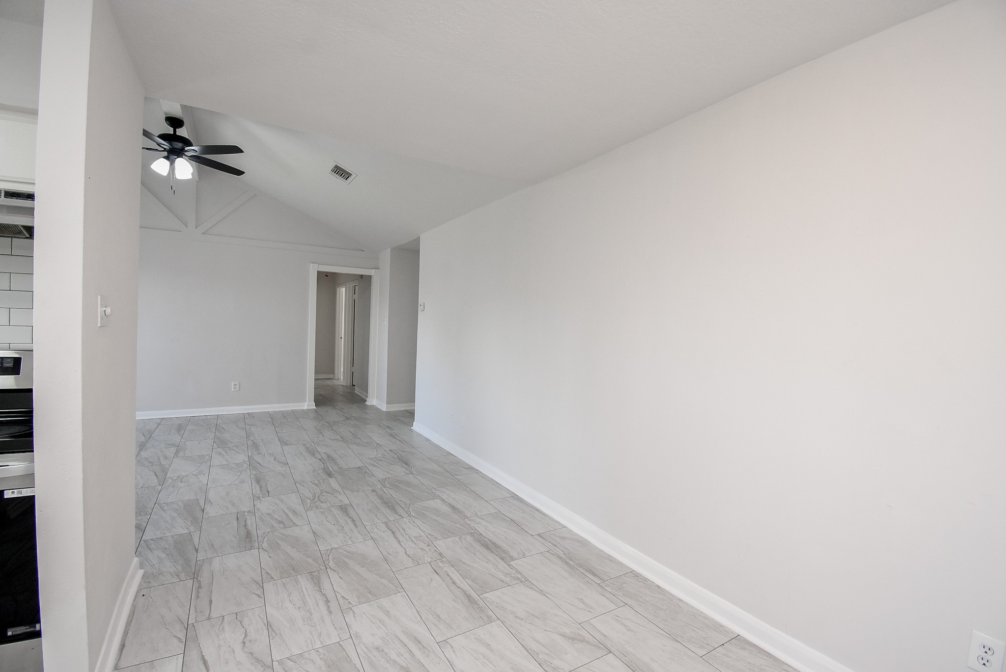 9527 Kingsvalley Drive Houston, TX 77075 - Photo 15 of 45 a view of empty room with a fan